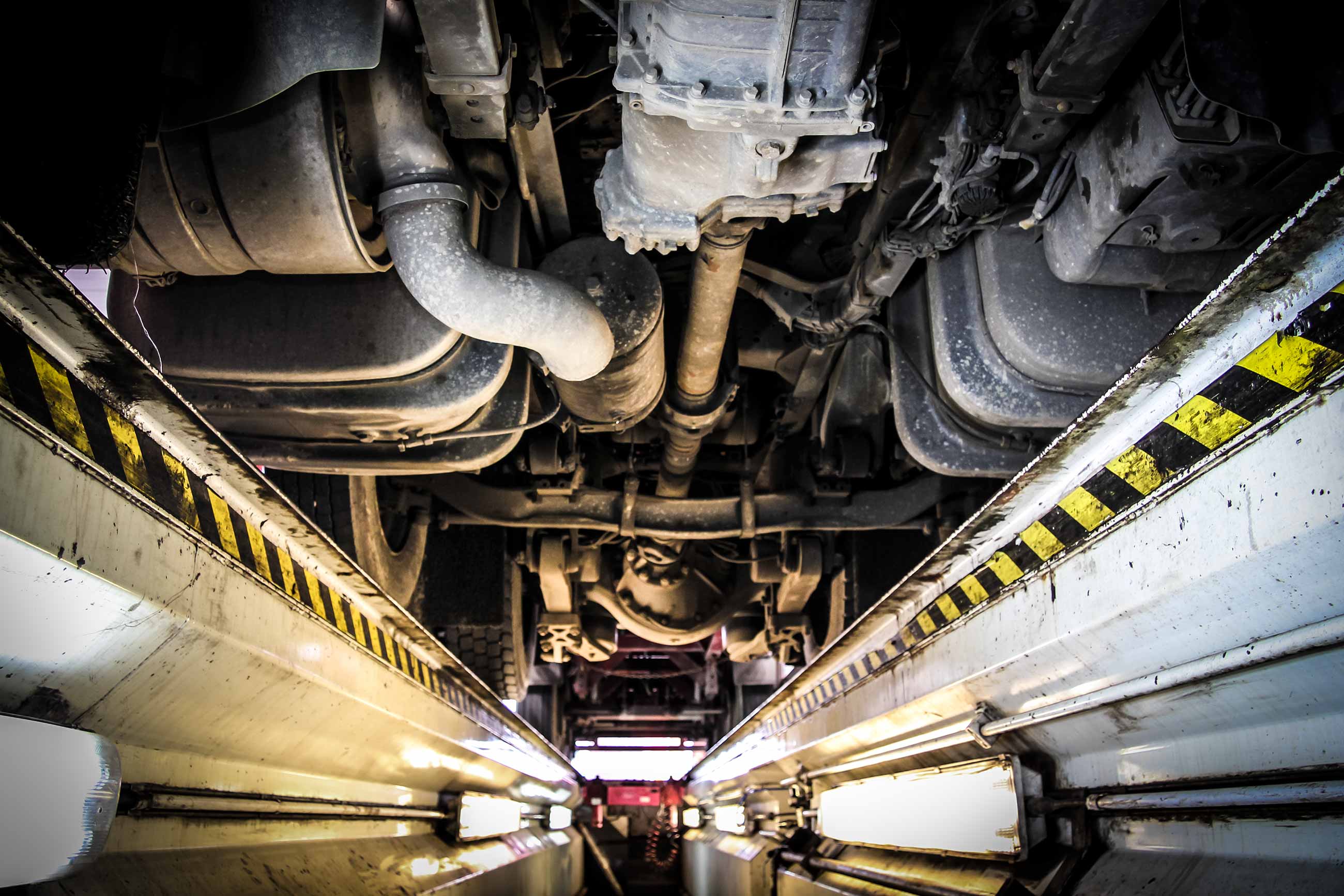 Technicians working on a fleet vehicle